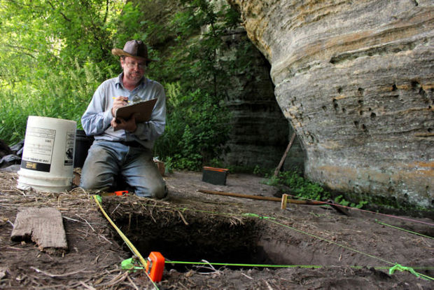 Scott Weisman, a participant in the University of Wisconsin-Baraboo/Sauk County's archaeology field school, makes notes near the excavation units Tuesday. The students have been working at a site in PierNatural Bridge Park in Rockbridge. (Photo: Baraboo News Republic)