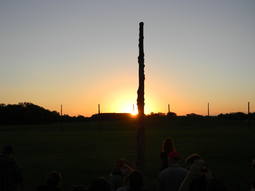 View of the fall equinox sunrise as seen from the reconstructed Woodhenge sun calendar at Cahokia Mounds. At the equinoxes the sun emerges from the front of Monks Mound, which is about 1/2 mile to the east. Photo courtesy William R. Iseminger.