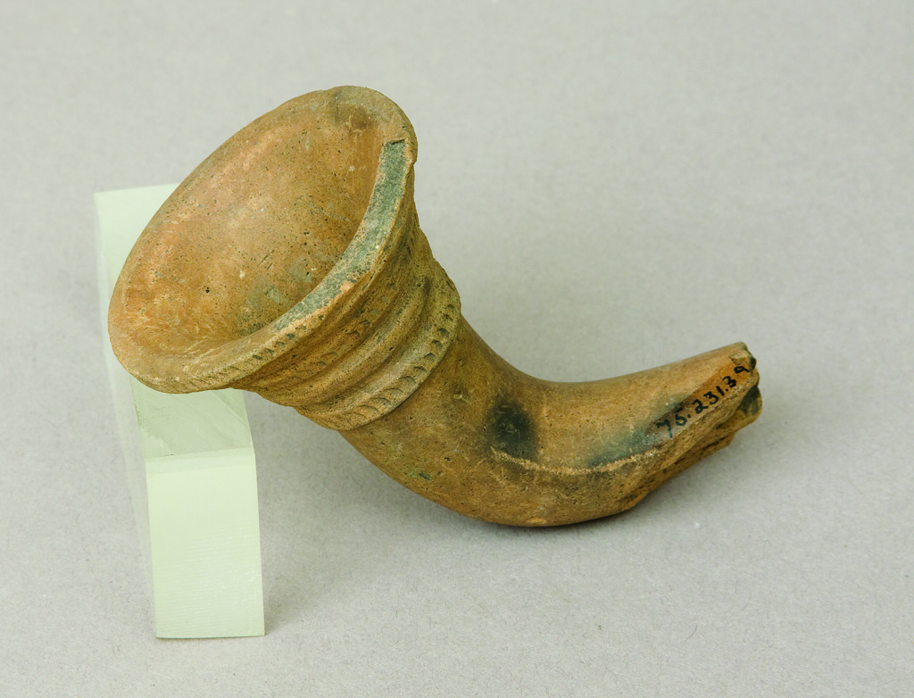 This fragment of a trumpet-style pipe was found at the site. Courtesy Rochester Museum & Science Center.