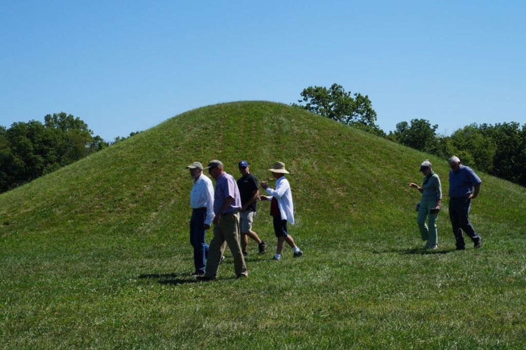 TAC board members and staff walk by the 17-foot high central mound at Mound City. Photo Bliss Bruen/ The Archaeological Conservancy.