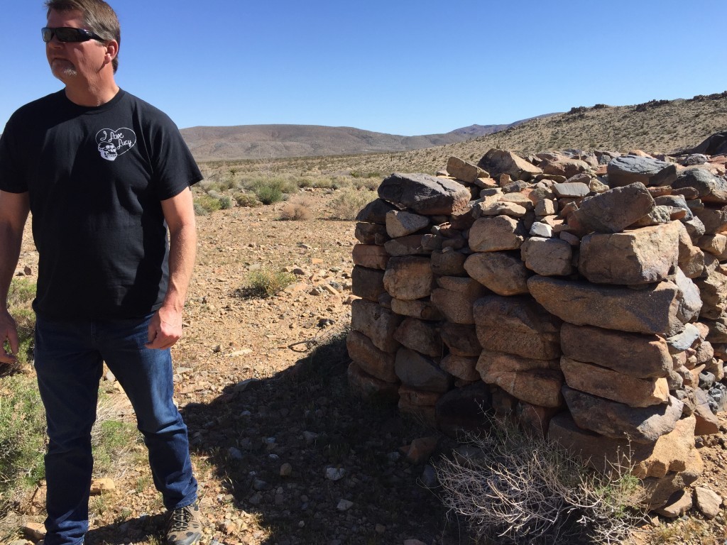 Western Regional Director on site , next to Historic Rock Walls