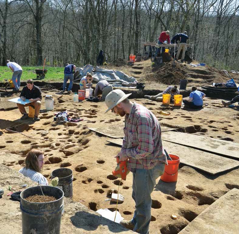 Archaeologists, students, and volunteers document hearths and posts associated with structures that once stood on the southern edge of the Fox Farm village. Credit Art Dickinson.