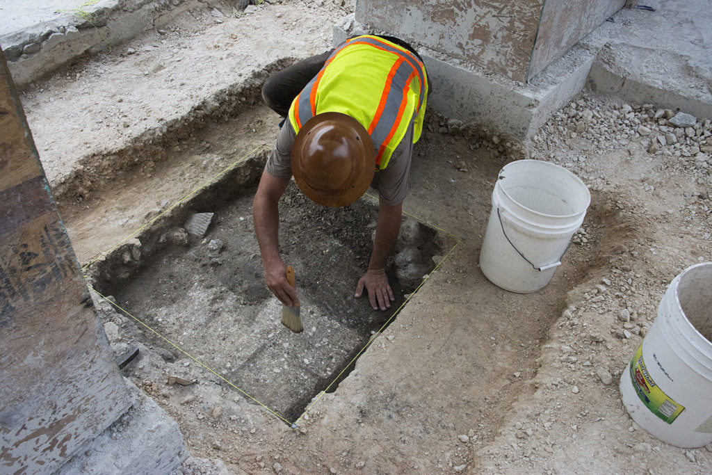 An excavator exposes adobe blocks. Credit: Reimagine The Alamo