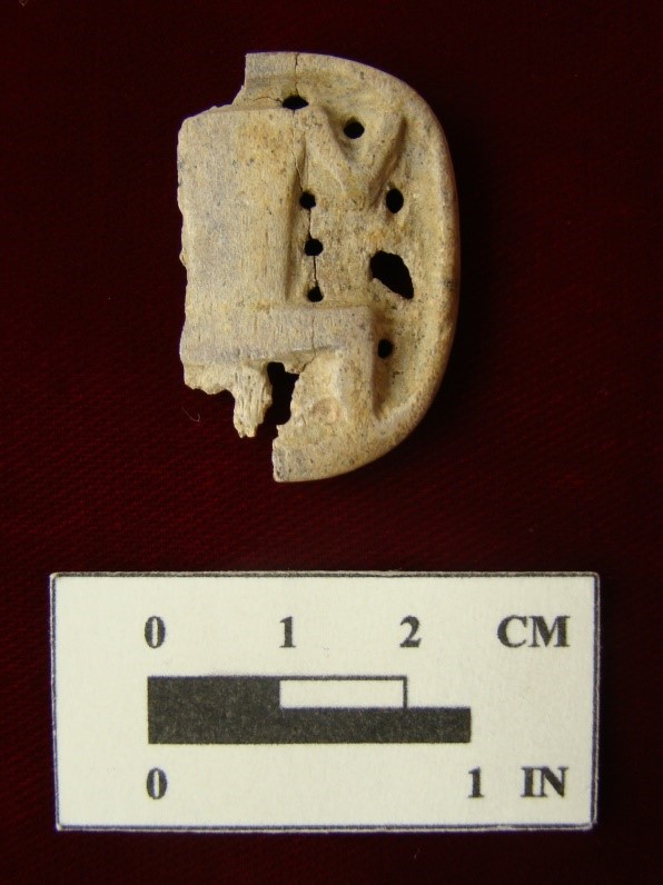 a bone carving of a squatting, headless human figure known as a “hocker.” Similar carvings have been found on sites in New York and Ohio.Courtesy of the Maryland Archaeological Conservation Laboratory at the Jefferson Patterson Park and Museum.