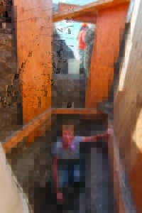 Lynn Gamble is seen inside a trench in a 6,000-year-old shell midden that was probably associated with ritual. Credit: Macduff Everton