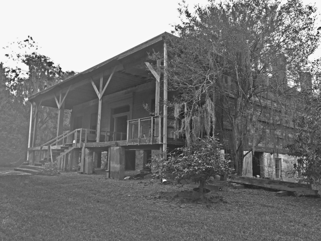 Black and white photo of old plantation house.